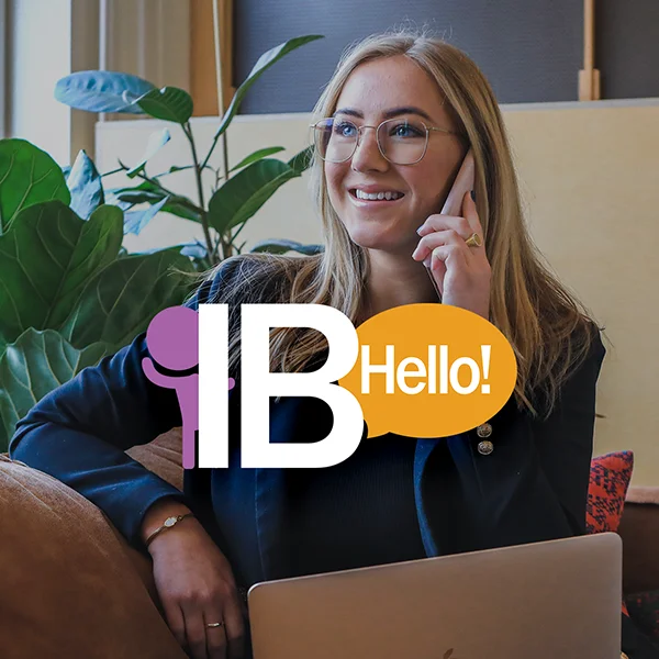 smiling woman on the phone using IB Hello Voicemail Capture System