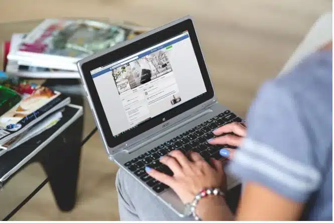 hands typing on laptop, digital marketing tips